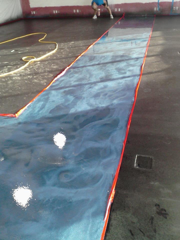 Blue metallic decorative concrete floor installation
